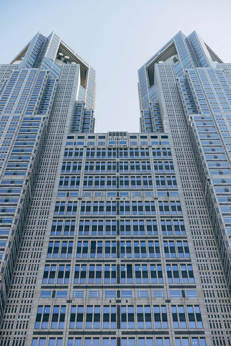 high rise white and blue concrete building town